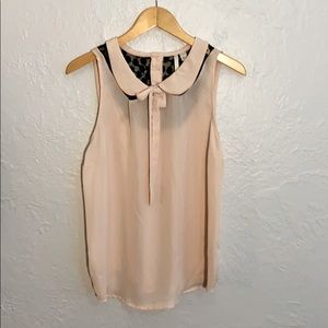 Sleeveless blouse with bow